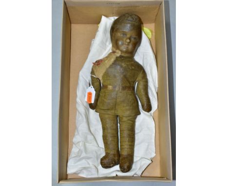 A VINTAGE CLOTH DOLL IN THE FORM OF A SOLDIER IN WWI BRITISH UNIFORM, printed cloth, moulded facial features, woodwool filled
