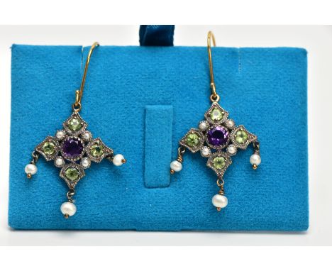 A PAIR OF GEM DROP EARRINGS, the central circular amethyst within a shaped surround set with four circular peridots and four 