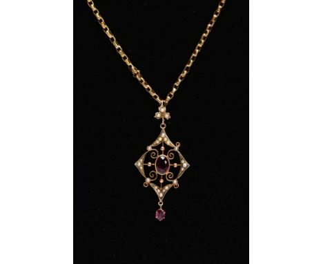 AN EARLY 20TH CENTURY GARNET AND SPLIT PEARL PENDANT NECKLACE, the openwork drop pendant, set with a central oval cut garnet 