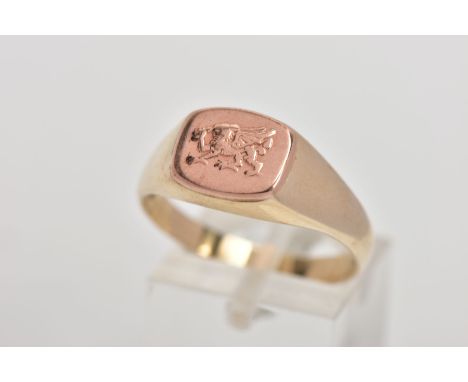 A 9CT GOLD BI-COLOUR CLOGAU SIGNET RING, the 'Welsh Dragon' design in rose gold to the central panel and tapered yellow gold 