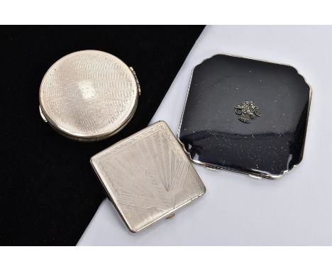 THREE COMPACTS, to include a 1960's silver Kigu of circular outline, with silver hallmark for London 1964, approximate gross 