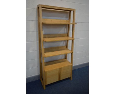 A MODERN LIGHT WOOD WATERFALL OPEN BOOKCASE, three open shelves above double cupboard doors, width 80cm x depth 47cm x height