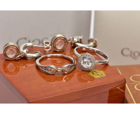 THREE ITEMS OF SILVER CLOGAU JEWELLERY, to include a cluster ring set with a central circular white topaz, another ring set w