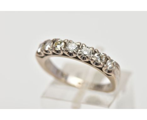 A WHITE METAL DIAMOND HALF ETERNITY RING, designed with a row of claw set round brilliant cut diamonds, total estimated diamo