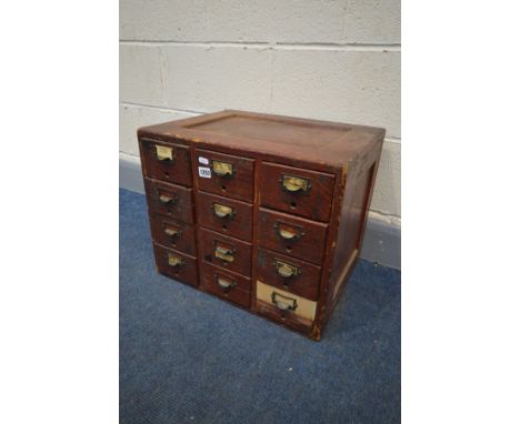 A VINTAGE STAINED PINE TWELVE DRAWER INDEX CABINET, width 51cm x depth 40cm x height 43cm (repair to one drawer)