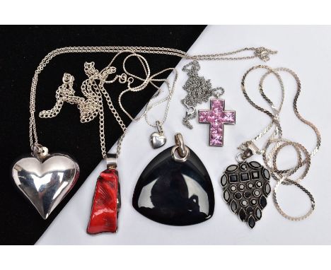 A SELECTION OF PENDANTS, to include a dyed branch coral pendant, a heart pendant, a cross pendant, a pear shape gem set penda