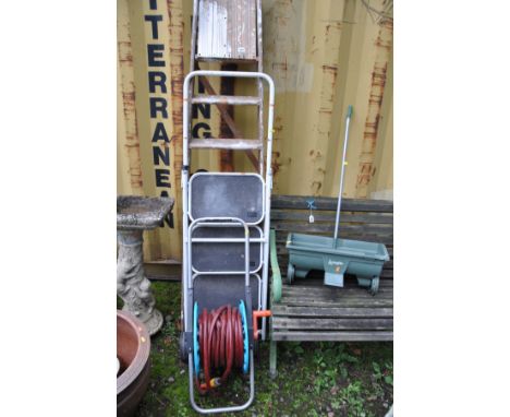 A SET OF WOODEN STEP LADDERS 197cm high, a set of metal steps, a lawn seeder and a hose reel (4)