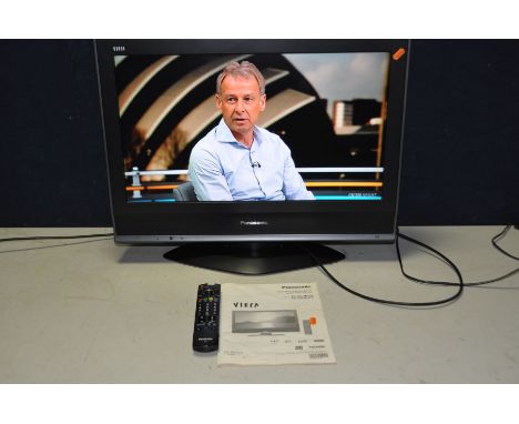 A PANASONIC TX 26LMD70 26in TV with remote and manual