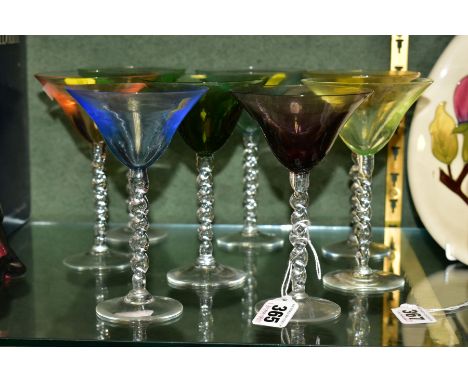 A SET OF EIGHT HARLEQUIN COCKTAIL GLASSES, with clear glass barley twist stems, height 15cm (condition: three with chips to r