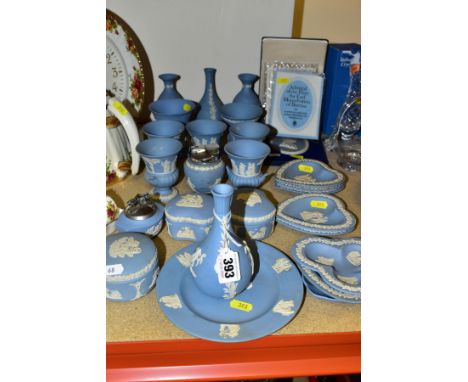 A GROUP OF WEDGWOOD PALE BLUE JASPERWARE, including bud vases, small Campania vases, two cigarette lighters, three trinket bo