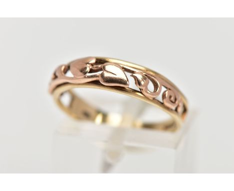 A 9CT GOLD CLOGAU RING, the tapered band with openwork 'Tree of Life,' design to the front half band, maker's mark and 9ct go