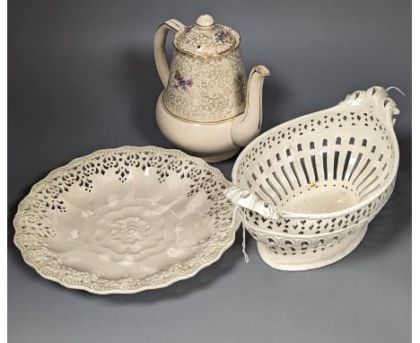An English 18th century creamware chestnut dish and stand and a serpentine dish, A gilt decorated jug and basin and a teapot,
