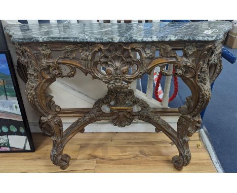 An 18th century style carved giltwood serpentine console table with serpentine marble top, width 140cm, depth 44cm, height 95