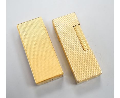 A gold plated Cartier lighter and a similar Dupont lighter