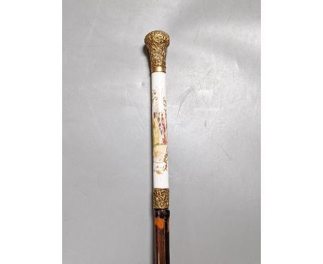 A porcelain mounted sword stick with gilt decoration to blade