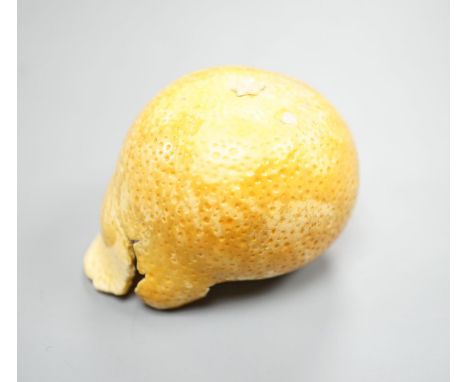 A Japanese carved ivory model of a partially peeled tangerine c.1900, 5cm