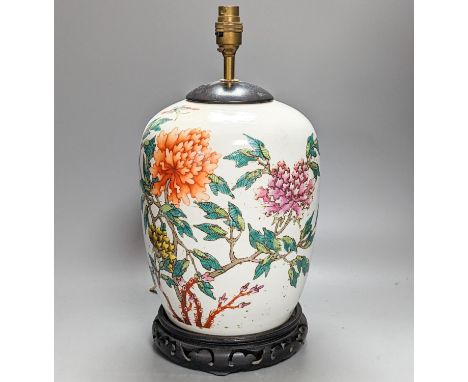 A Chinese famille rose jar now mounted as a lamp, 41 cm high to lamp fitting