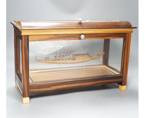A calamander cased model of an Ancient Egyptian barge, width 42 cms