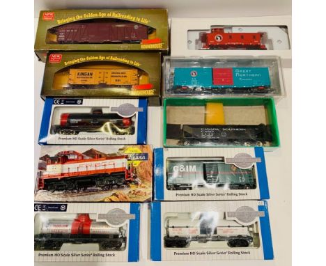 HO scale assorted freight wagons and an Athearn diesel locomotive