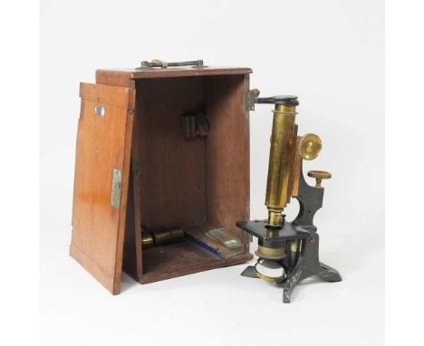 A 19th century brass microscope, 29cm high, in a fitted mahogany case