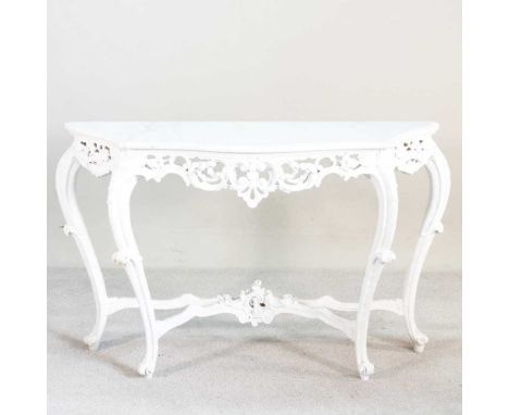 A modern carved and cream painted console table, with a shaped white marble top130w x 45d x 84h cm