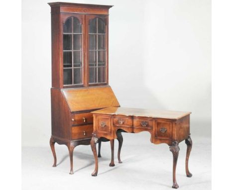 A 1920s mahogany bureau bookcase, 83cm wide, together with a 1930s walnut writing table, of Queen Anne style (2)83w x 47d x 2