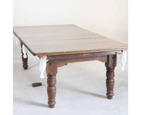 An Edwardian Riley 'The Combine' oak patent snooker dining table, with a slate bed, on turned legs, stamped E J Riley Limited