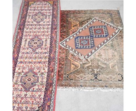 A Persian runner, with geometric designs on an ivory field, 295 x 84cm, together with two others smaller (3)