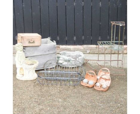 An iron three tier corner garden plant stand, together with various garden items and statues (11)