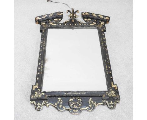 A 19th century ebonised wall mirror, of 18th century design, with a carved surround and gilt decoration, 118 x 86cm