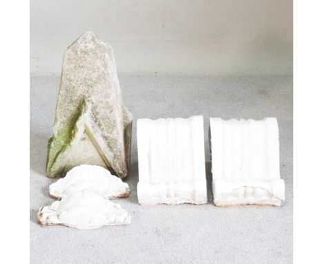 A pair of plaster corbels, together with a pair of smaller and a stone carving, 55cm high (5)