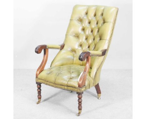 A Victorina style green leather upholstered button back armchair, on bobbin turned legs