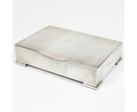 A silver table cigarette box, with engine turned decoration and a cedar lined interior, stamped Asprey London, Birmingham 195