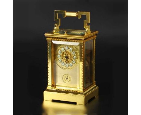 A modern brass cased carriage clock, the enamel chapter ring with Arabic hours and subsidiary dial, having a platform escapem