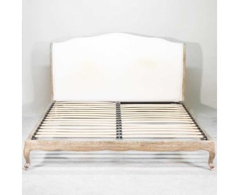 A French style limed super king bedstead, by Sleep Room.com, with a padded head board214w x 180d x 119h cmOverall condition i
