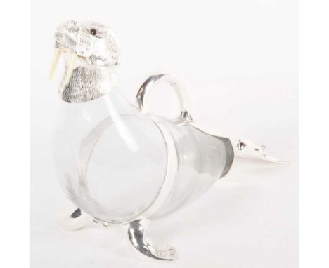 A modern clear glass and plated novelty claret jug, in the form of a walrus, with a hinged lid, 28cm high