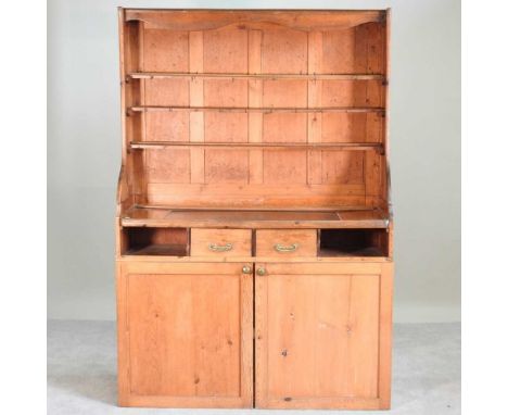 A rustic pine dresser, with a boarded plate rack130w x 48d x 190h cm