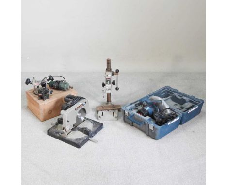 A Bosch electric router, cased, together with a circular saw and another (3)