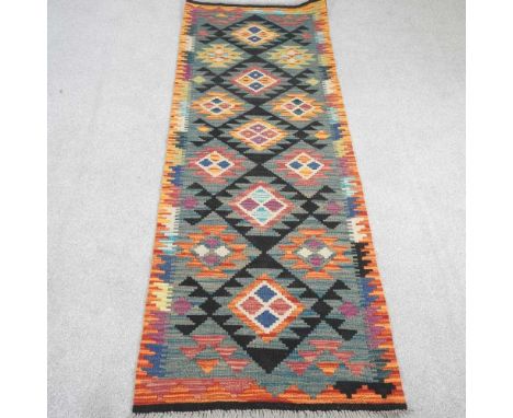 A kilim runner, with rows of coloured squares, 194 x 61cm