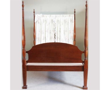 A reproduction mahogany four poster double bedstead, with reeded supports and a padded base215w x 158d x 209h cm