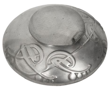 Archibald Knox for Liberty &amp; Co, A Tudric pewter inkwell, model 05201of squat circular from with hinged cover cast with b