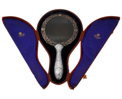 A late Victorian cased silver magnifying glass London, 1888, by William Leucharspierced foliate scroll frame with masks, the 