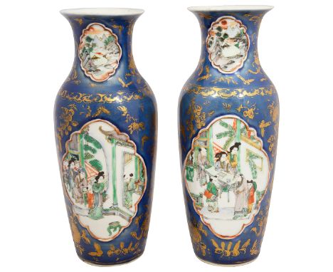 A pair of 19th Century Chinese export famille vert and powder blue ground vases of slender tapering form, decorated with shap