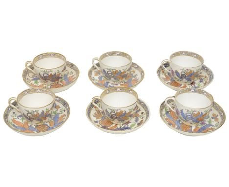 An early 19th century Derby porcelain six piece tea service gilt decorated, with scrolling foliate and flowerhead motifs and 