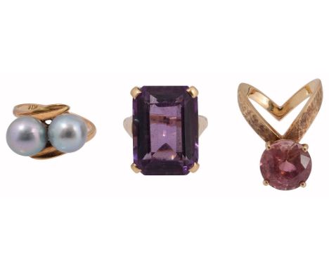 Three gem-set rings:  a  grey cultured pearl cross-over ring stamped 'K18'; a rectangular-cut amethyst  to the plain shank st