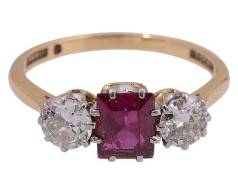 A ruby and diamond three stone ringthe central rectangular step-cut ruby set to either side with a brilliant-cut diamonds to 