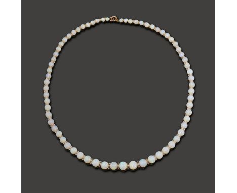 A white opal bead necklacegraduated in size from 8.0mm to 2.5mm, each separated by a faceted rock crystal spacer, to the bolt