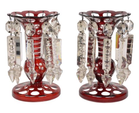 A pair of 19th century Bohemian ruby flashed lustre vasesbaluster stems suspended with chains of beaded drops and cut glass p