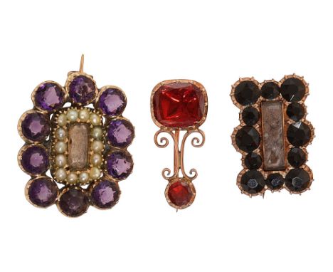 Three 19th century brooches: two with  plaited  hair to the centre and one with a  half pearl surround, all mounted  in gold 