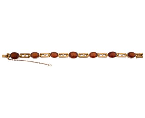 A citrine and pearl set braceletthe oval collet-set citrines alternating with pearl set openwork bar links, the clasp stamped